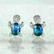 2 Ct Oval Cut Simulated Blue Topaz Turtle Stud Earrings 14k White Gold Plated