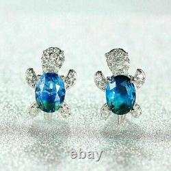 2 Ct Oval Cut Simulated Blue Topaz Turtle Stud Earrings 14K White Gold Plated