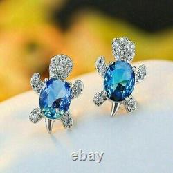 2 Ct Oval Cut Simulated Blue Topaz Turtle Stud Earrings 14K White Gold Plated