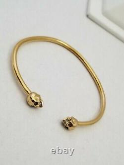 Alexander mcqueen thin twin skull bracelet Authentic gold plated