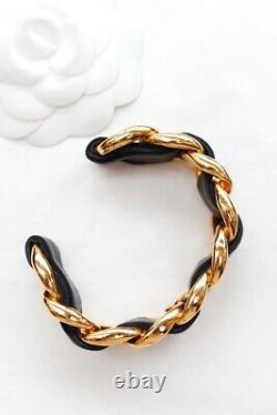 CHANEL Iconic gilted metal chain bracelet with black leather link