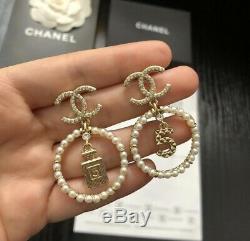 Chanel gold double CC logo motif crystal embellished stud pierced earrings