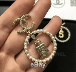 Chanel gold double CC logo motif crystal embellished stud pierced earrings