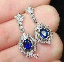 Oval Cut Simulated Blue Sapphire Women's Drop Earrings In 14k White Gold Plated