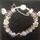 Pandora Silver Bracelet With Gold Clasp And 18 Beautiful Charms